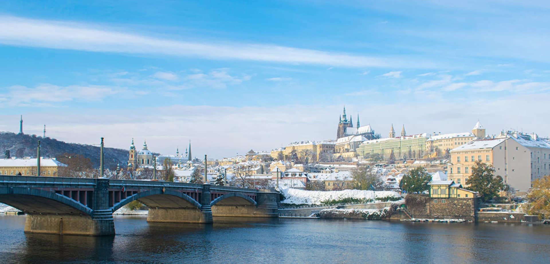 Cold winter morning in prague snow in the city and prague castle