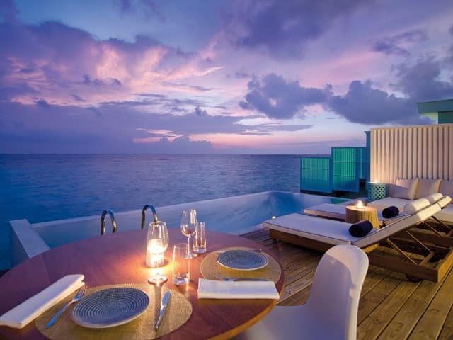 Amilla maldives sunset water pool villa deck