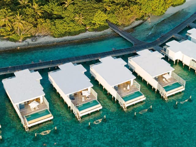 Amilla maldives sunset water pool villa exterior