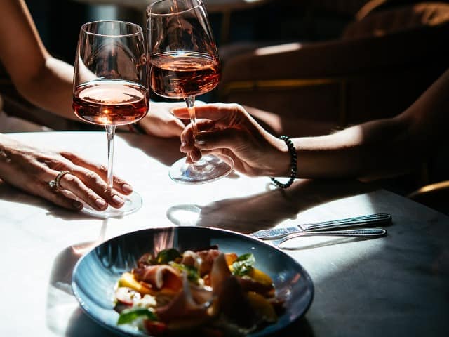 Glasses of rose wine seen during a friendly party or a celebration in a restaurant of a bar