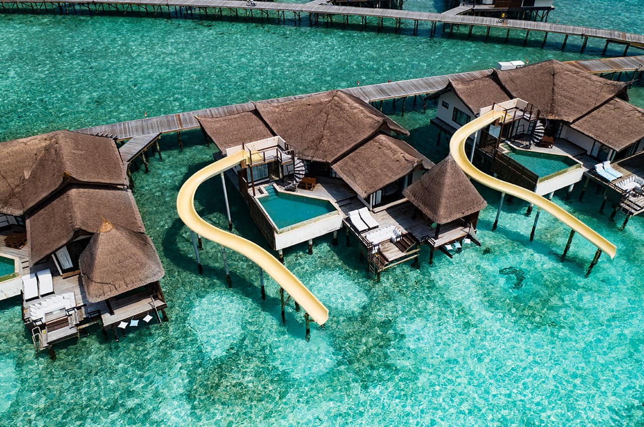 Ozen reserve bolifushi ocean pool suite with slide aereo