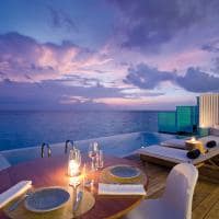 Amilla maldives sunset water pool villa deck