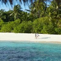 Dusit thani maldives couple on beach