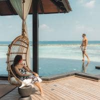 Sun siyam irufushi maldivas couple beach